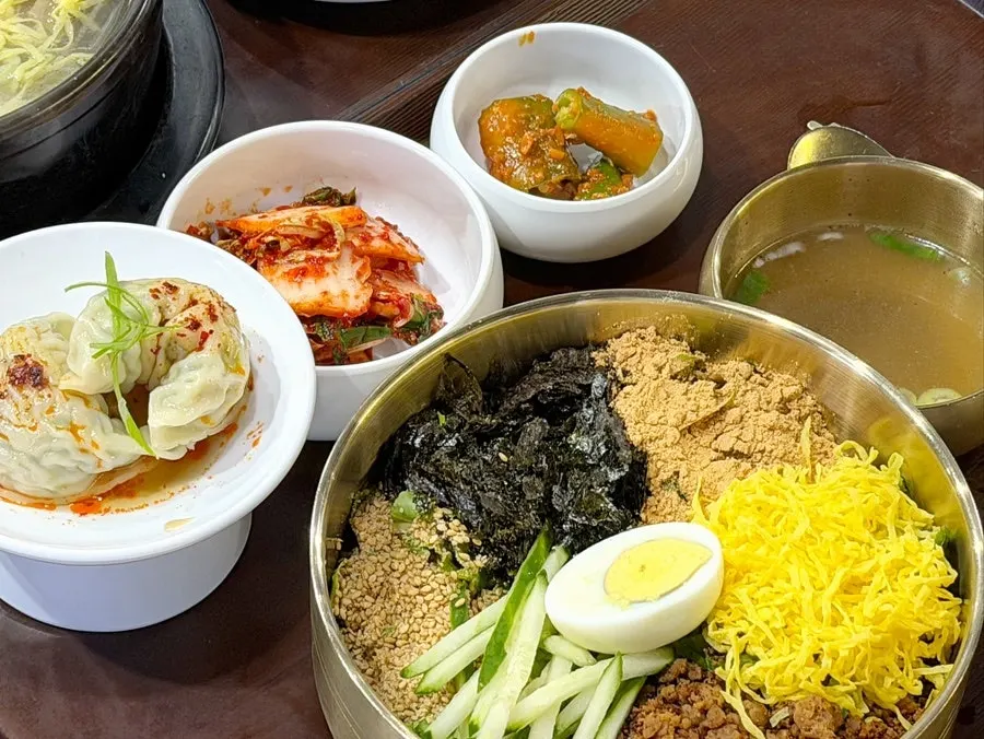 Bibim kalguksu with meat dumpling set spread