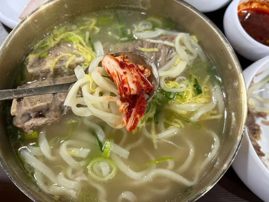 Kimchi served alongside the bone kalguksu
