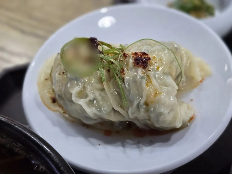 Two plump, fully-stuffed dumplings