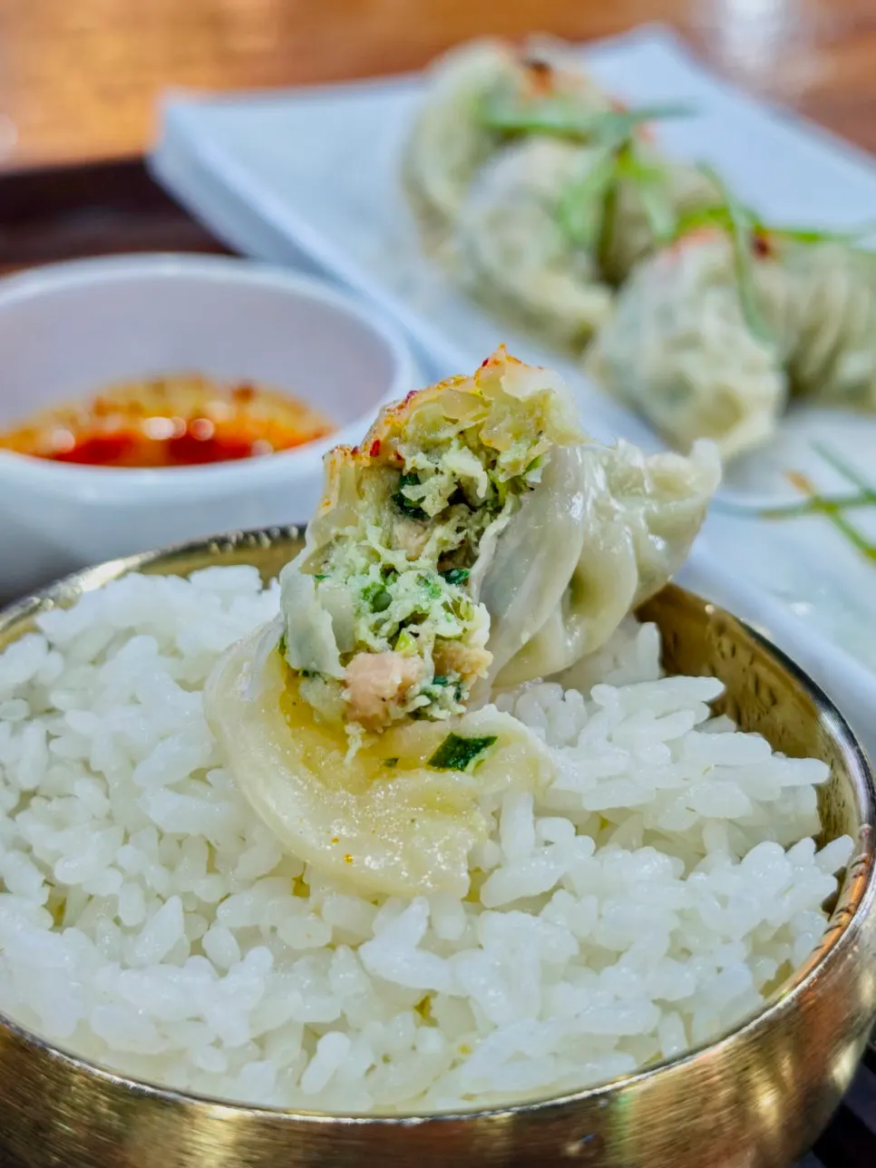 A dumpling cut in half showing the filling