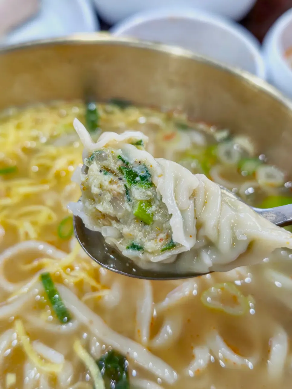 Dumplings and rice swirled into the broth like mandu-guk