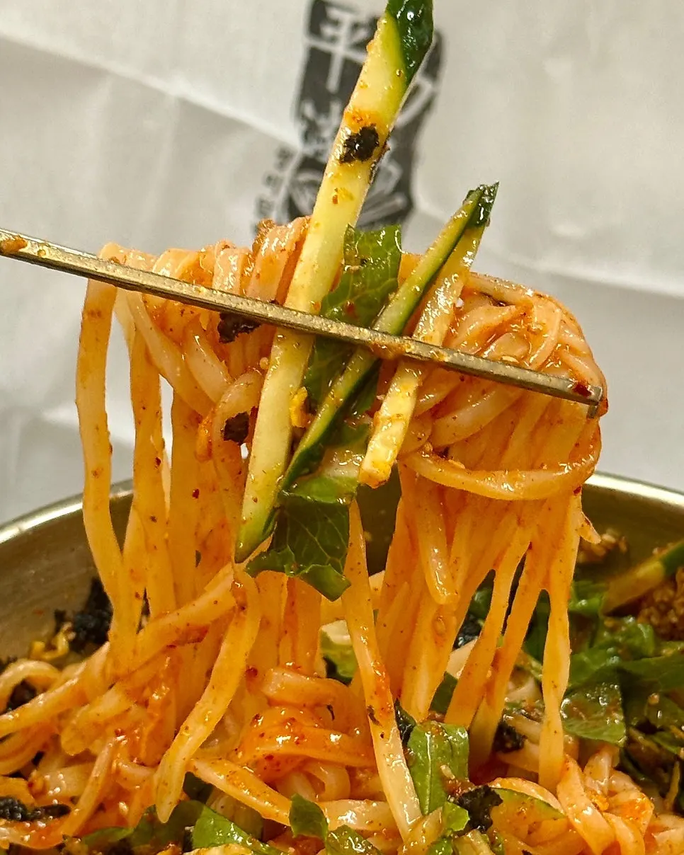 Bibim kalguksu with ground meat and perilla powder mixed in