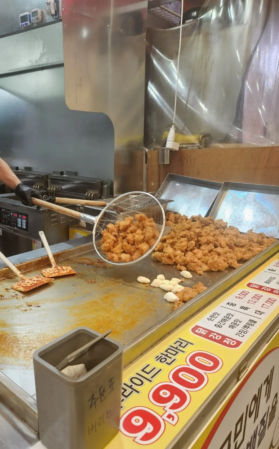 Sign showing mild, medium spicy, and spicy sauce options