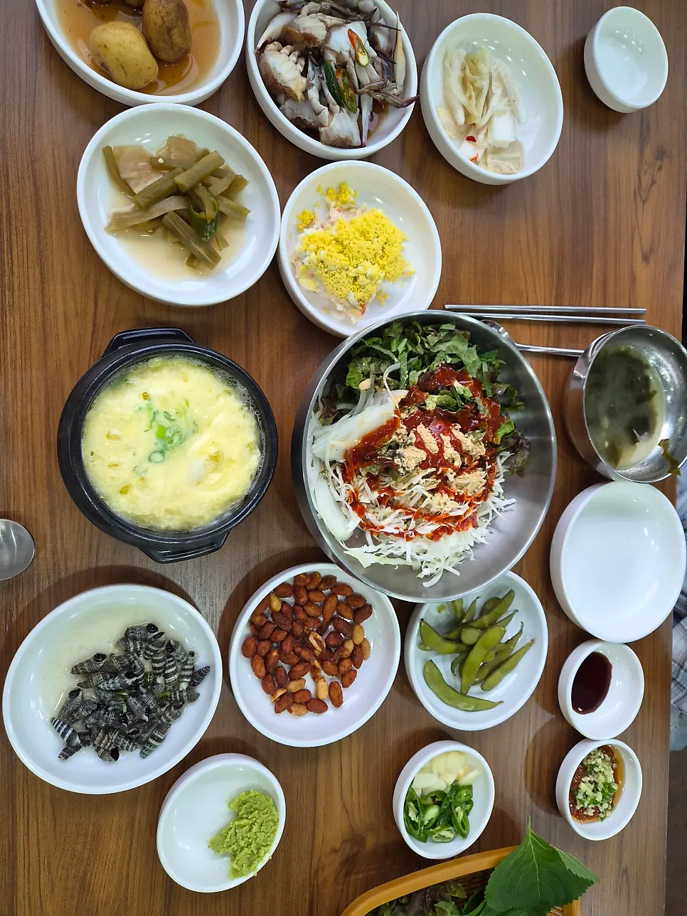 A full spread of banchan on the table