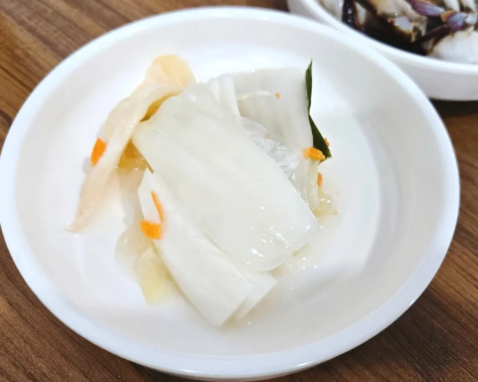 White kimchi served alongside the sashimi