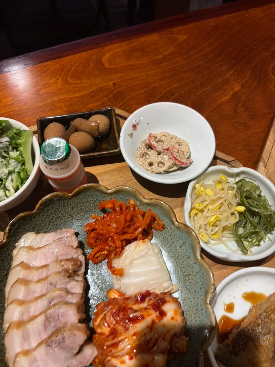 Table setting with water kimchi and other side dishes