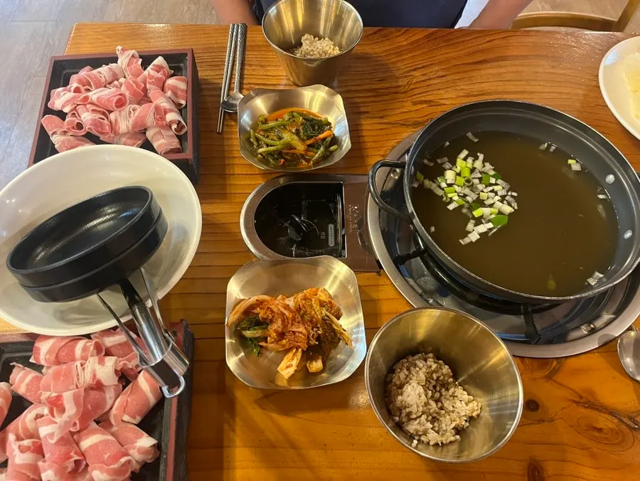 Two plates of beef brisket with barley rice