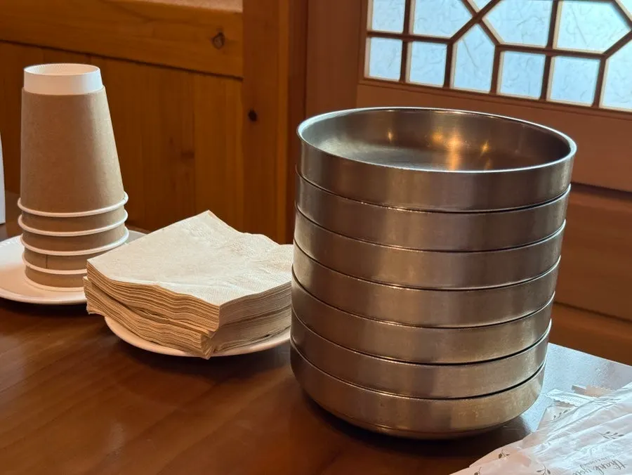 Plates and napkins set on the room table