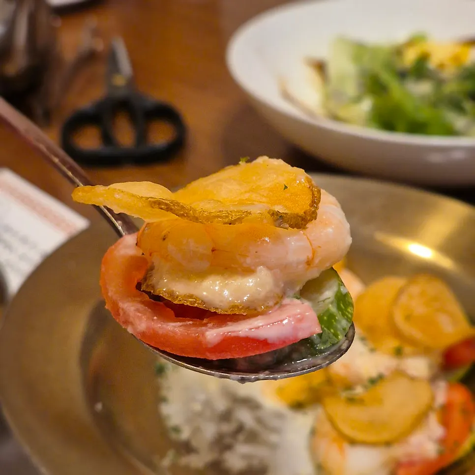 Bite-sized shrimp-pine nut salad served on a spoon