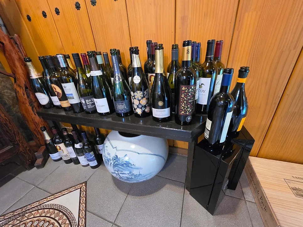 Wine bottles displayed in Suksudaega's cellar