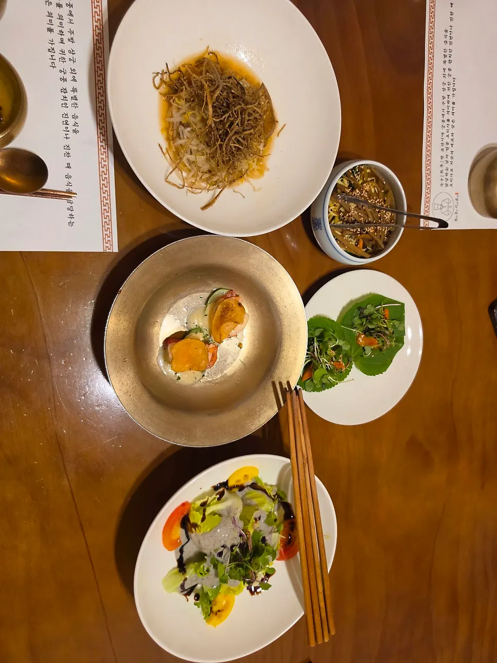 Seasonal salad and vinegared appetizer among course starters