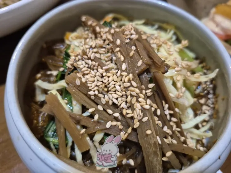 Three-color namul plate with japchae underneath