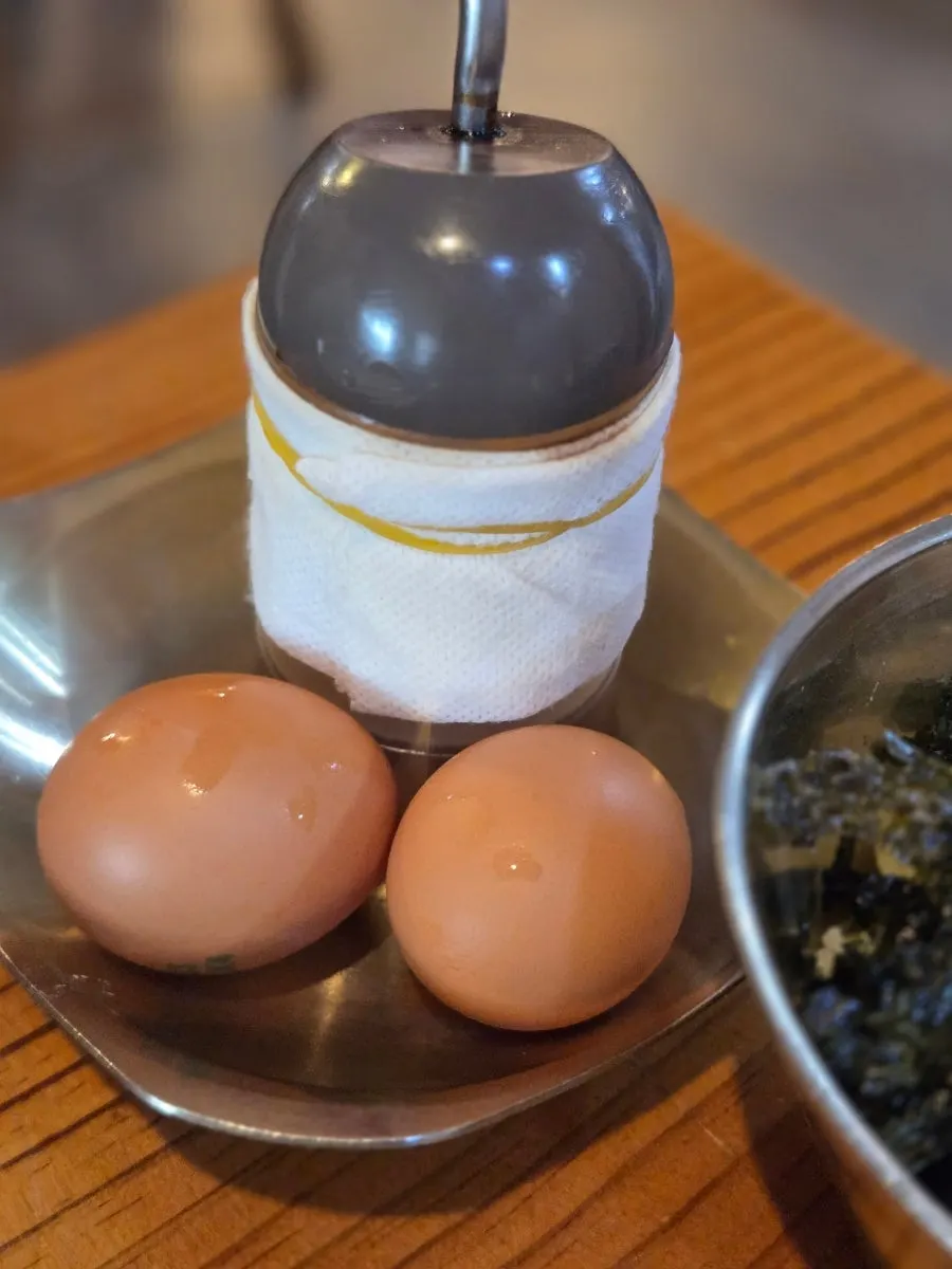 A bowl of self-serve egg porridge ingredients
