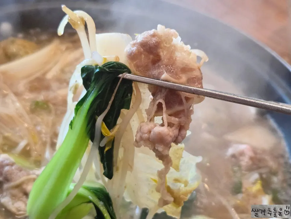 Dumpling extras cooking in the broth