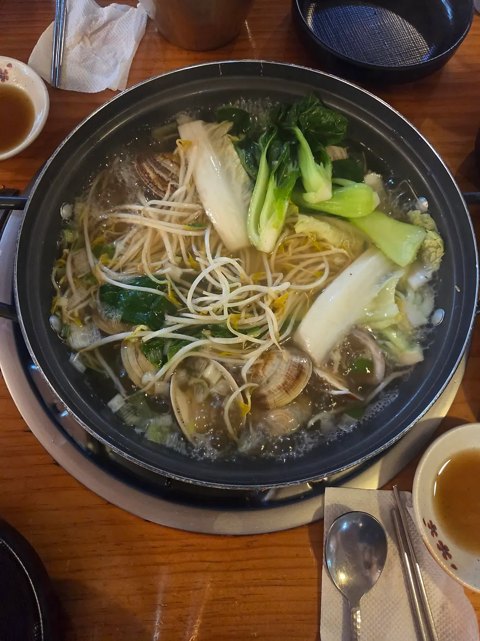 Kimchi meatball mandu dipped into the broth