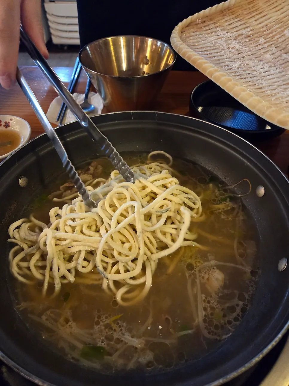 Spicy kalguksu with added seasoning paste