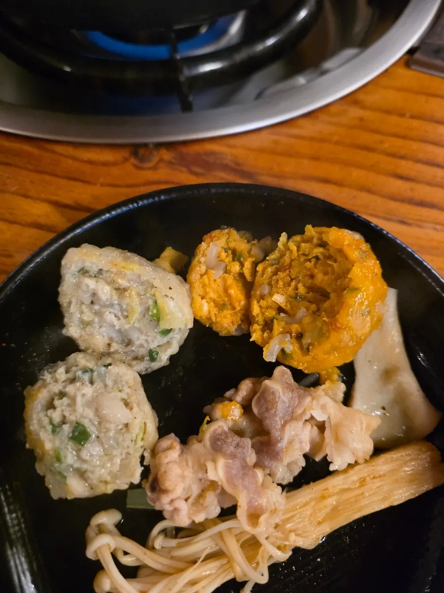 Cooked woo-samgyeop lifted out of the broth
