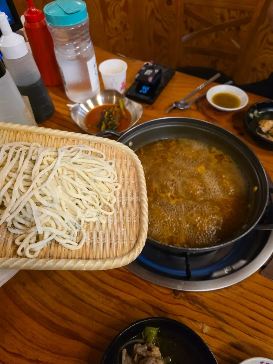 Shabu-shabu pot filled generously with extra meat