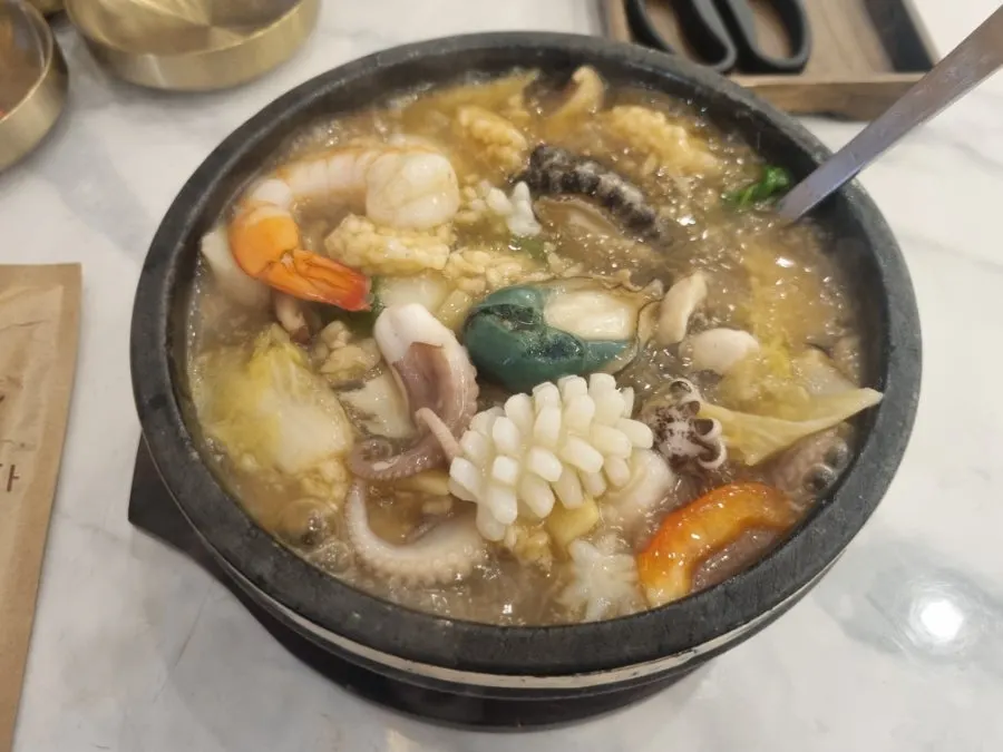 Nurungji-tang filled with shrimp, squid, and other seafood