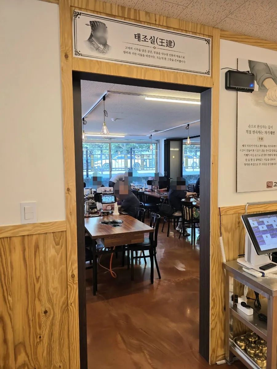 Spacious restaurant interior in wood tones and ivory colors