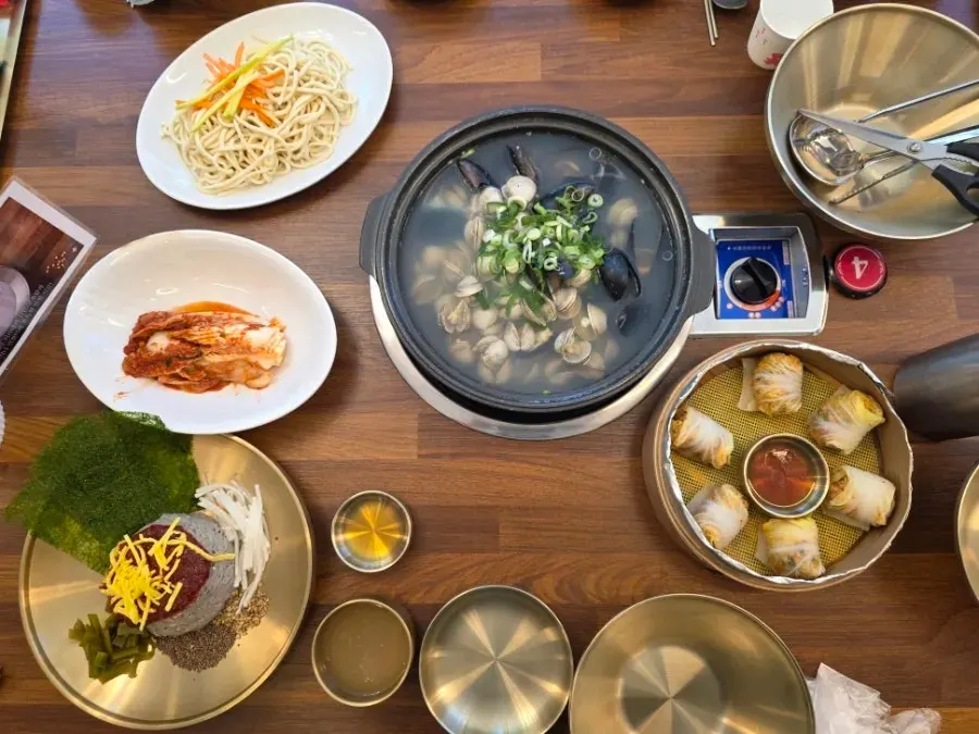 Table set with kalguksu and side dishes