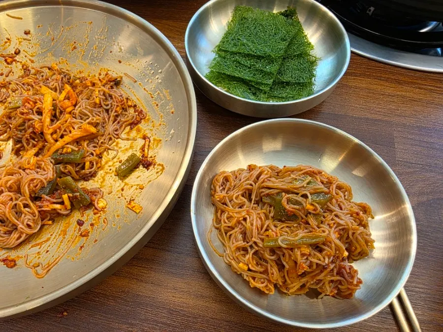 Close-up of bibim goldongmyeon before adding sesame oil and broth