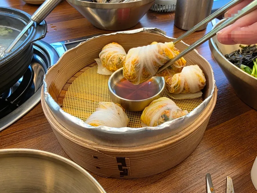 Filling of napa cabbage dumplings with kimchi, meat, and glass noodles