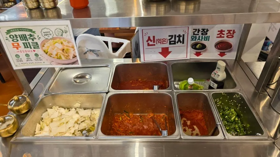 Fermented kimchi and cabbage pickles at the self-serve bar