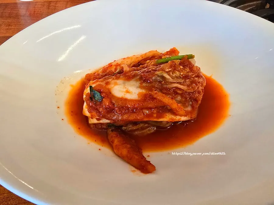 A plate of house-made kimchi brought by staff