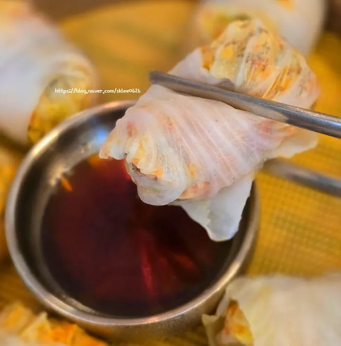 Cross-section of a napa cabbage dumpling showing kimchi filling