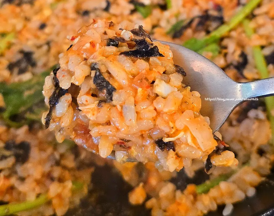A bowl of fried rice served onto a side plate