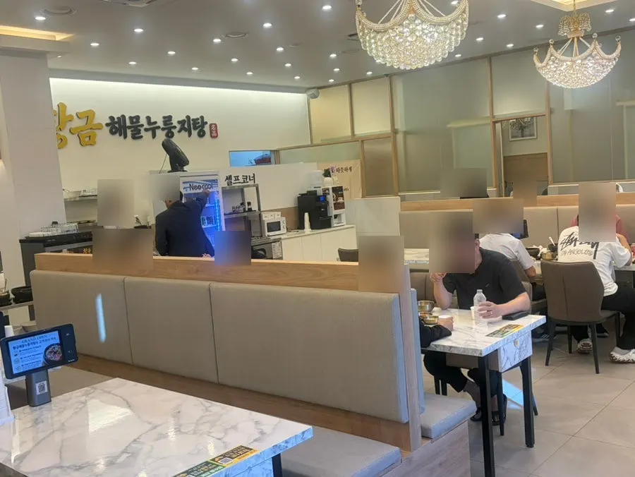 Spacious restaurant interior with a beige-toned design