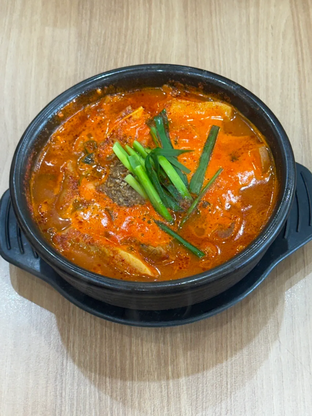 Close-up of the spicy pork soup with plenty of boiled pork