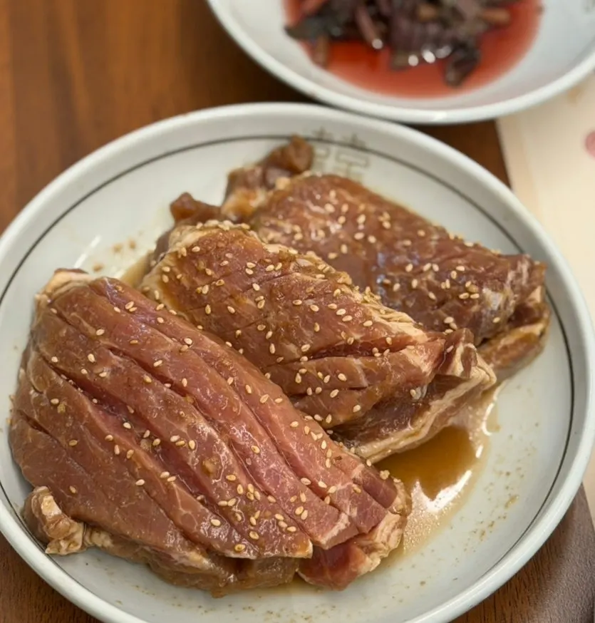 Galbi accompaniments including shredded radish salad