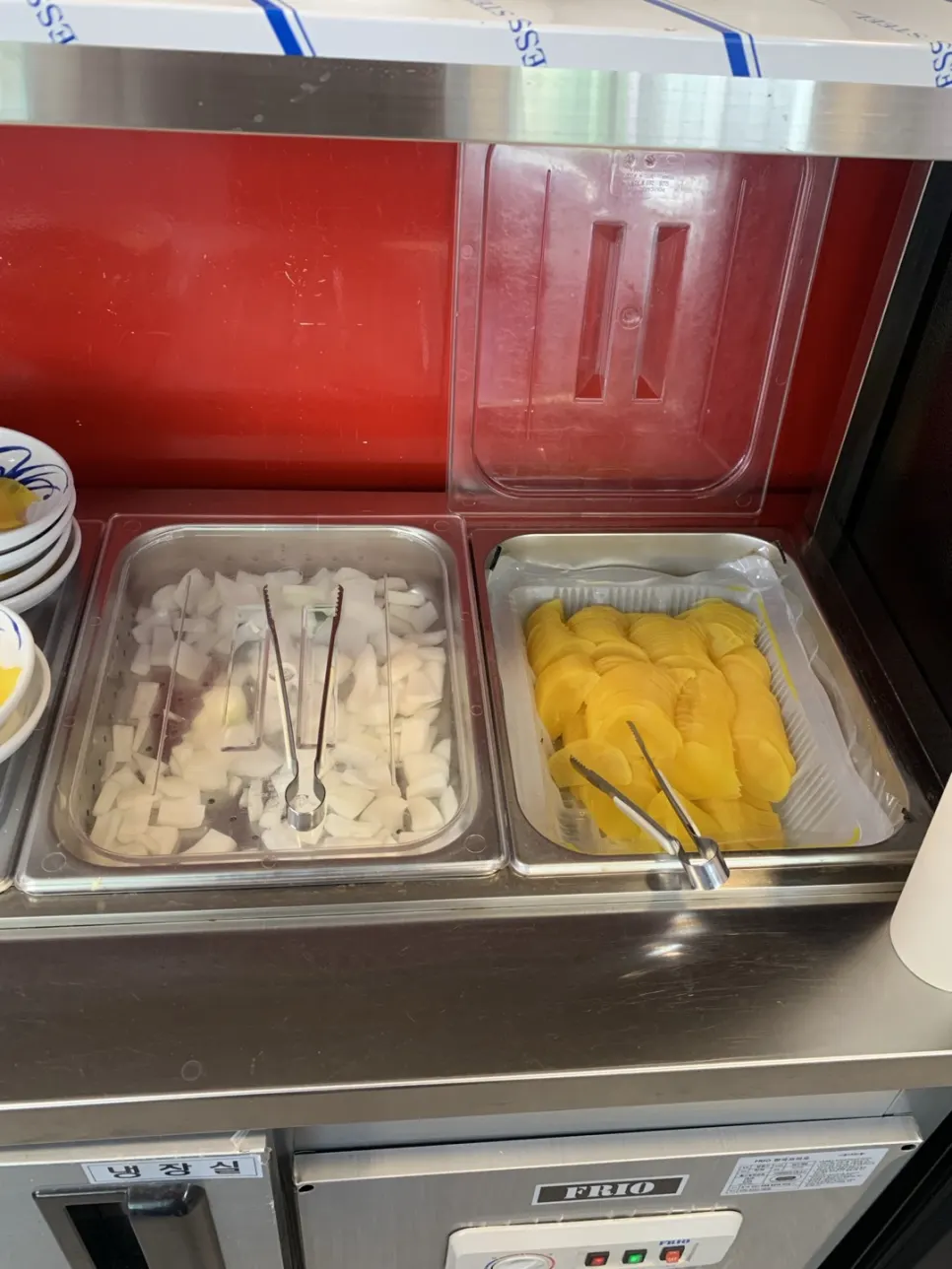 Raw onion and danmuji prepared at the self-serve bar