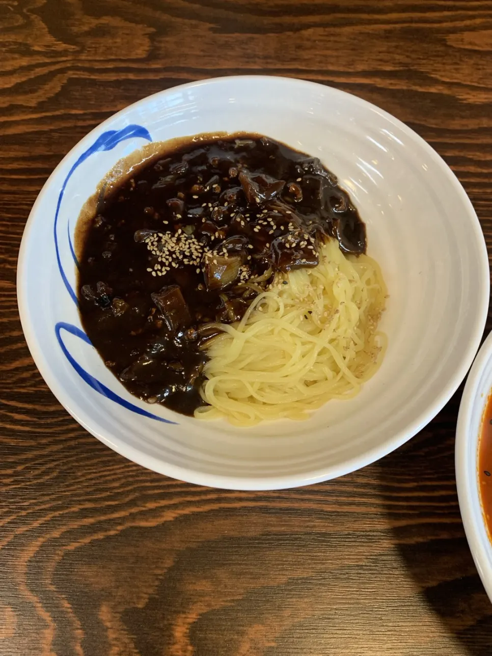 A bowl of jjajangmyeon with thin noodles