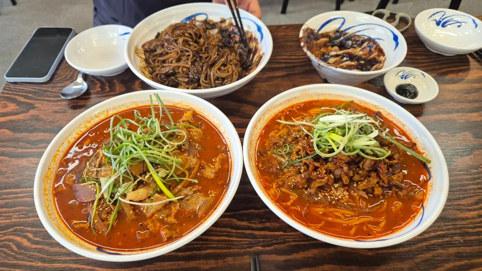 Three Chinese dishes being shared