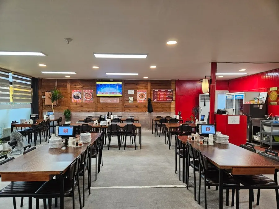 Interior of the Chinese restaurant with wide table spacing