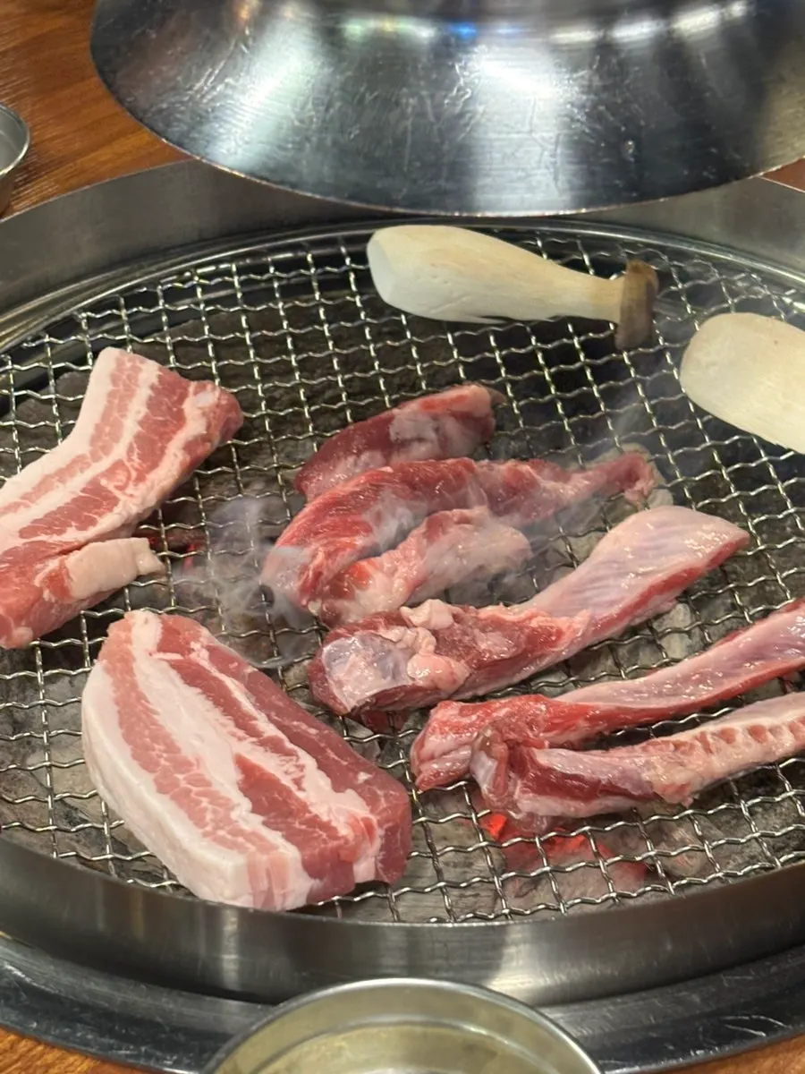 Pork belly and vegetables on the grill