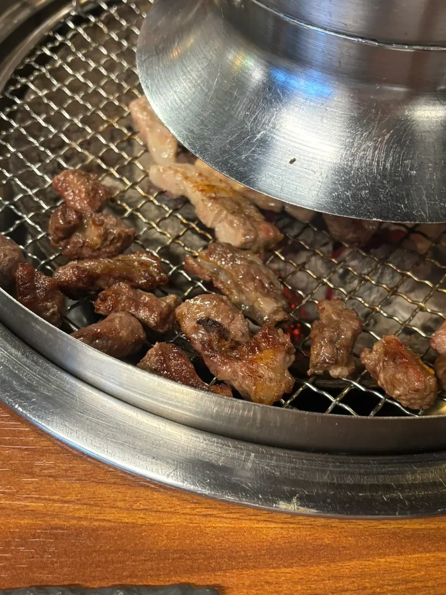 Self-serve bar steamed corn placed on the charcoal grill