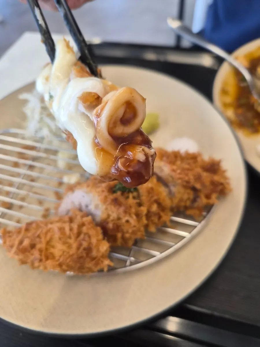 Chewy udon noodles coated in mince curry sauce