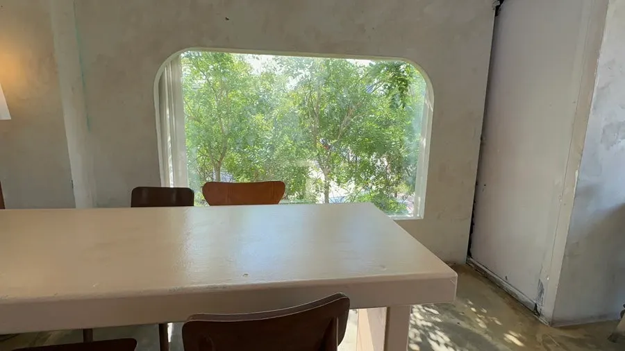 Second floor seating in the main building with many windows