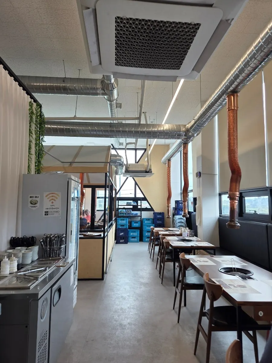 Interior of Ihwajeong with generously spaced tables