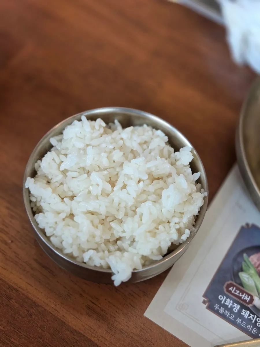 A scene of rice and meat enjoyed together