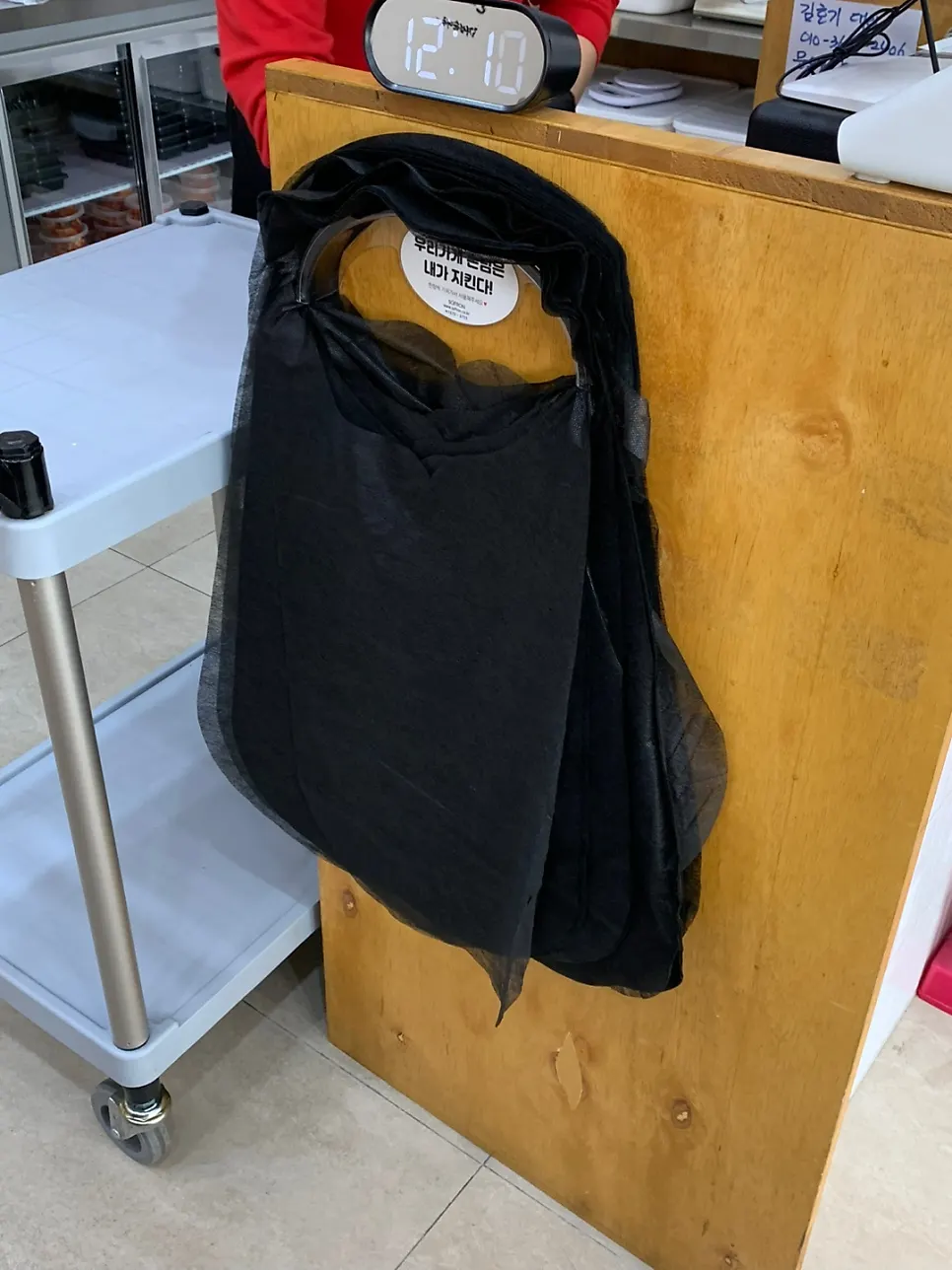 Disposable aprons next to the register