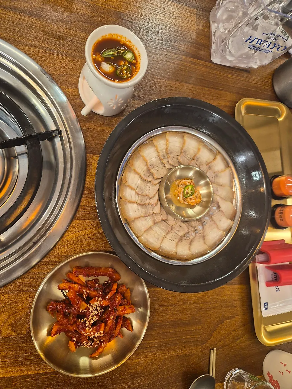 Pork belly bossam served in a heated bowl
