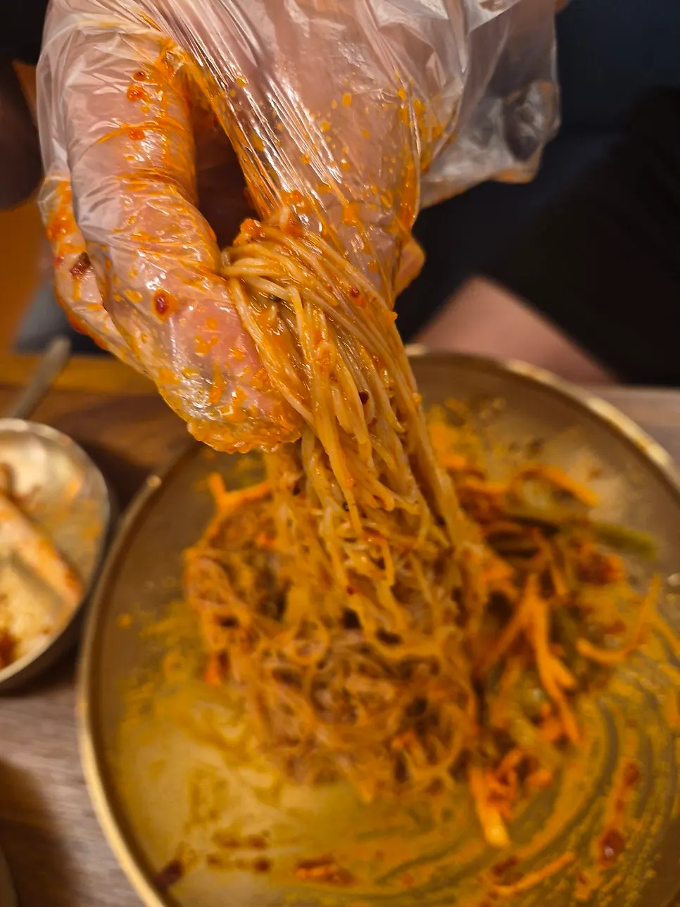 Bibim goldongmyeon mixed with sauce and perilla oil