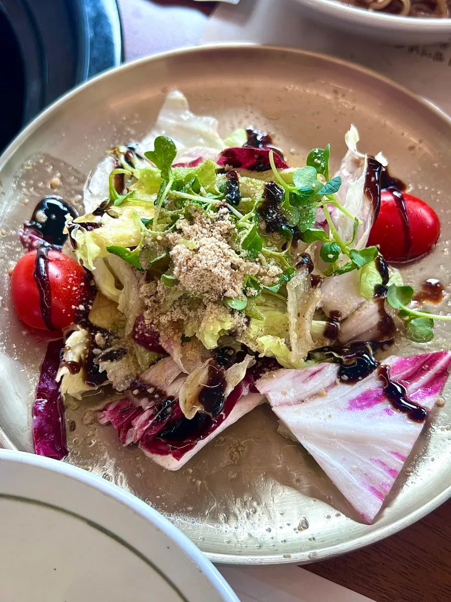Fresh vegetable salad drizzled with dressing