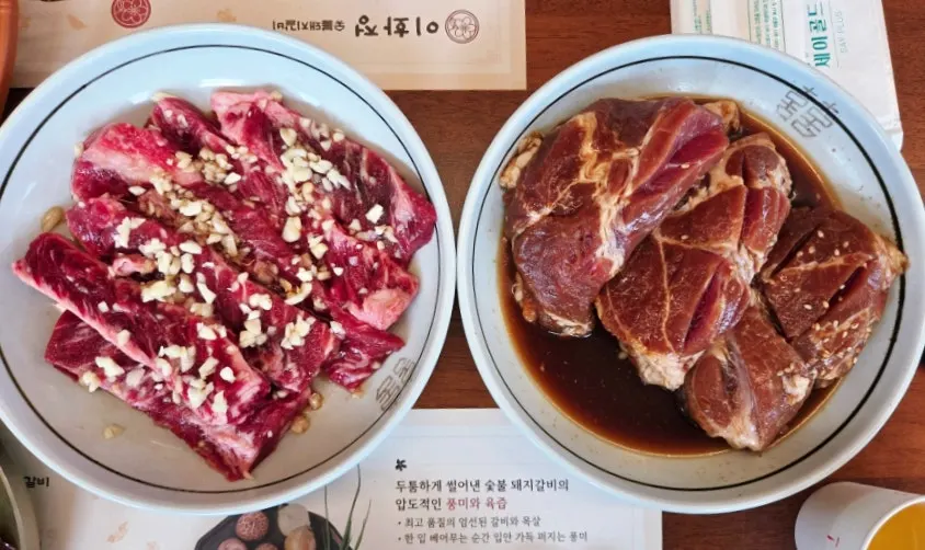 Table spread of 2 servings of beef galbisal and 2 servings of seasoned pork grill