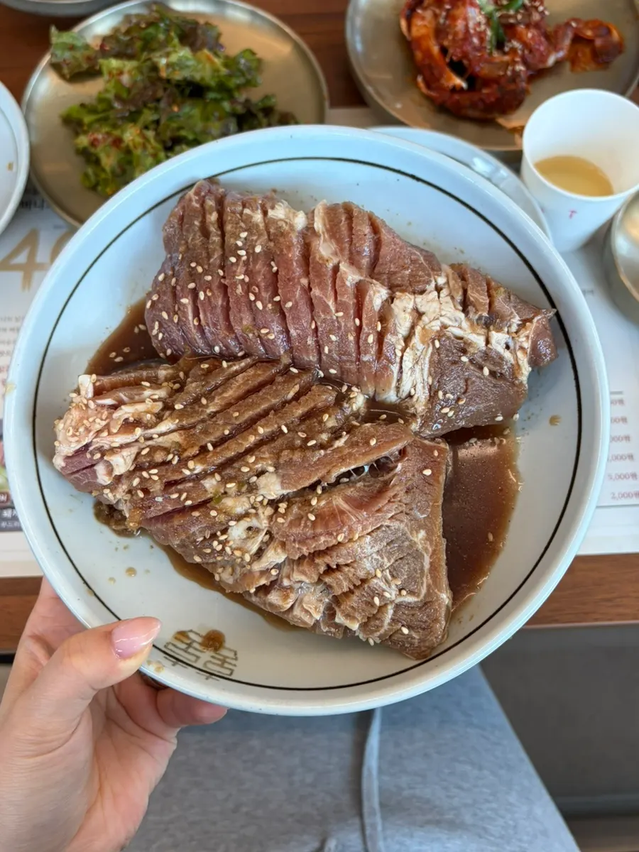 Raw 2cm-thick pork galbi laid out on the table